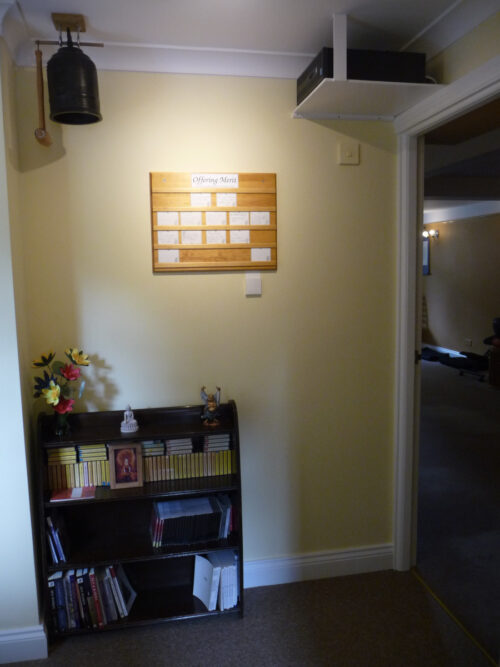 The board on the wall outside the meditation hall