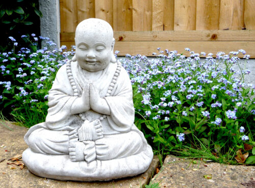 Statue with forget-me-nots