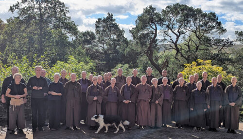 A group photo in front of the 'Seven Pines'